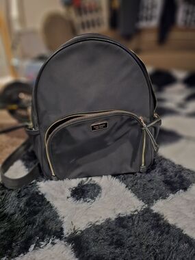kate spade black backpack with gold hardware